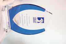 ADNOC corporate acrylic award with blue accent panels