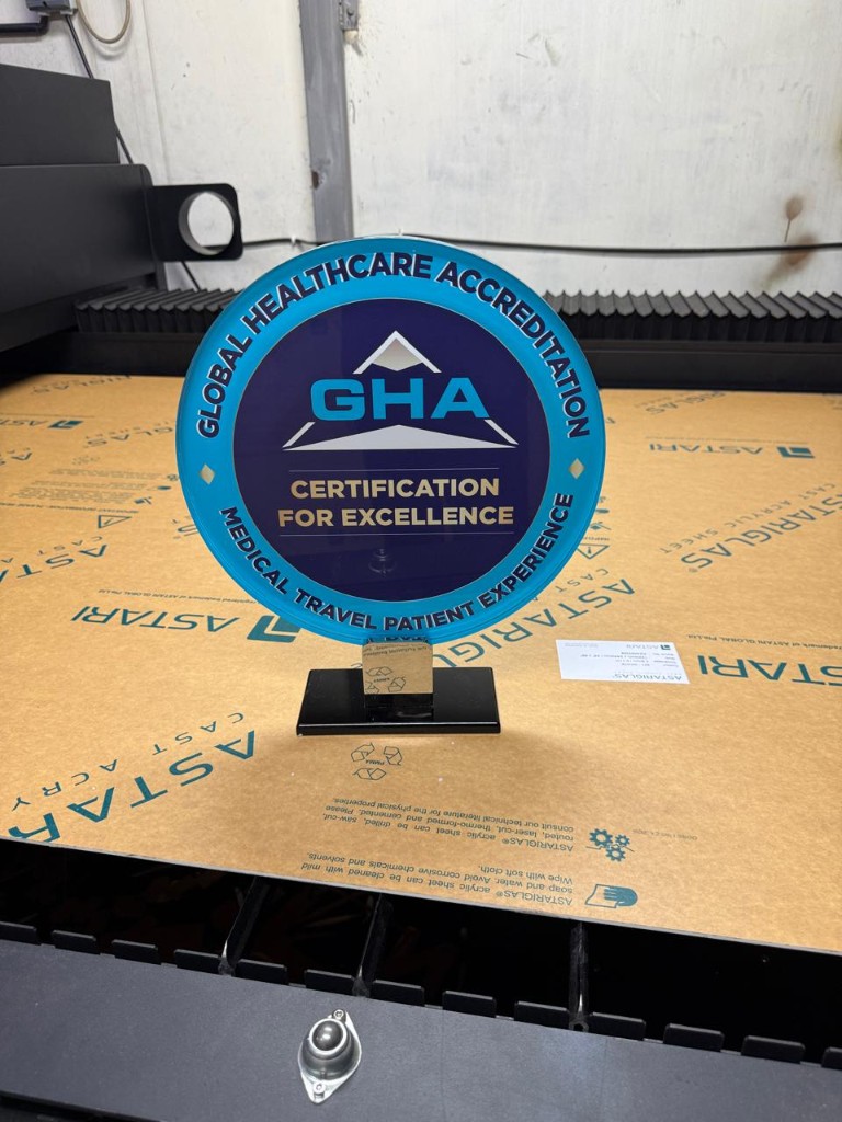 Global Healthcare Accreditation acrylic award on laser bed