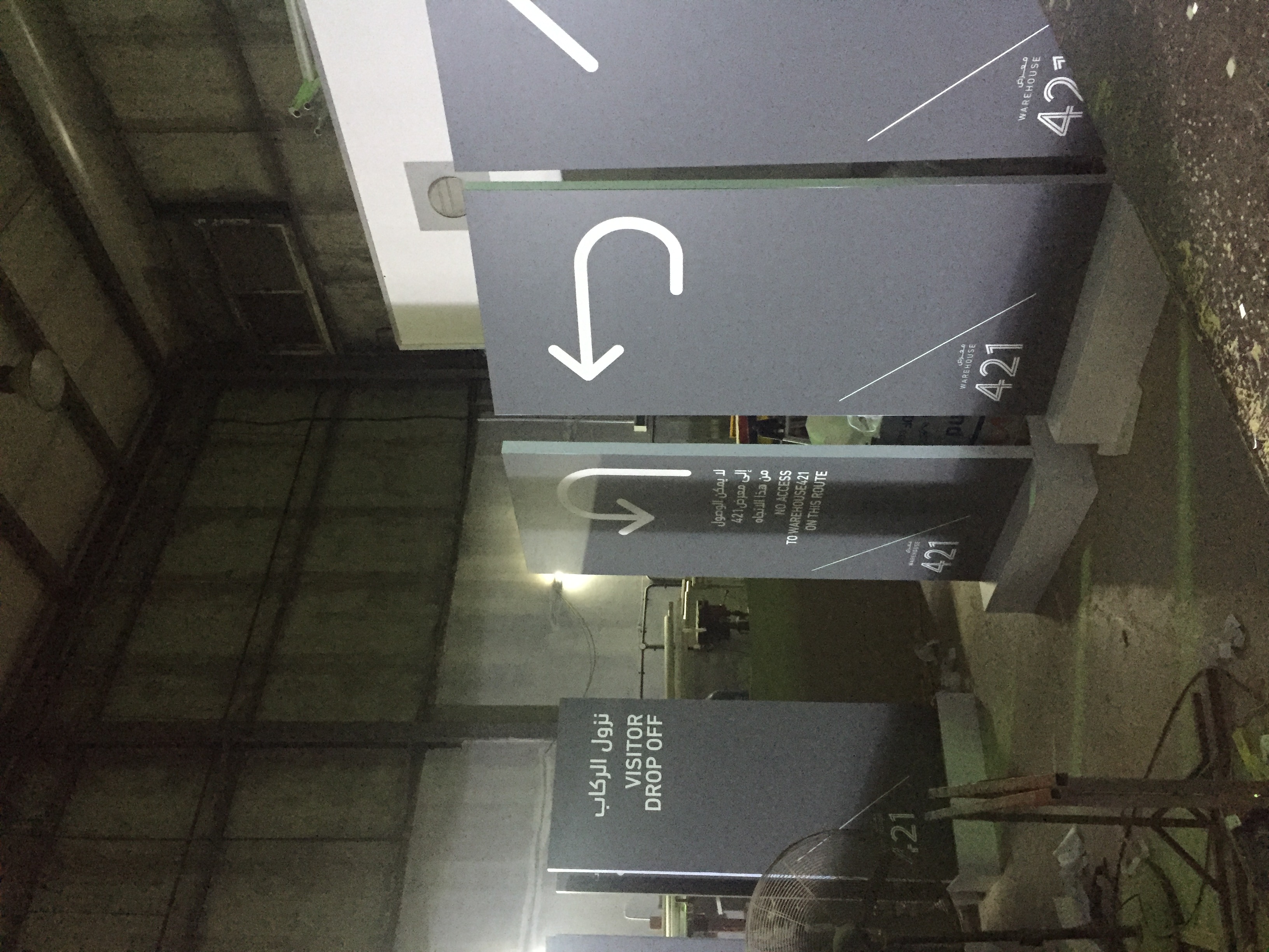 Hanging parking direction sign with arrow