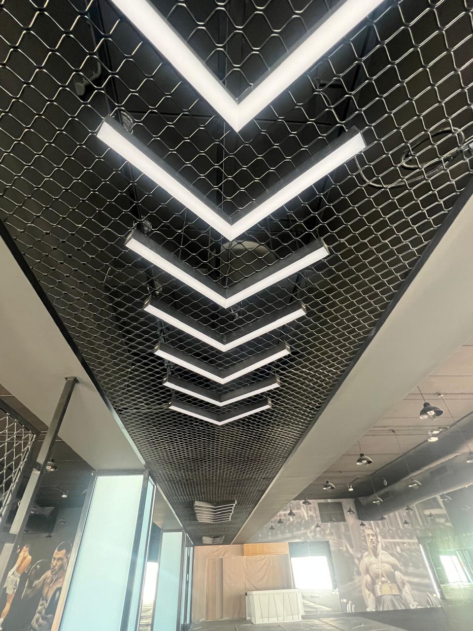 Interior ceiling fit-out with linear illuminated panels