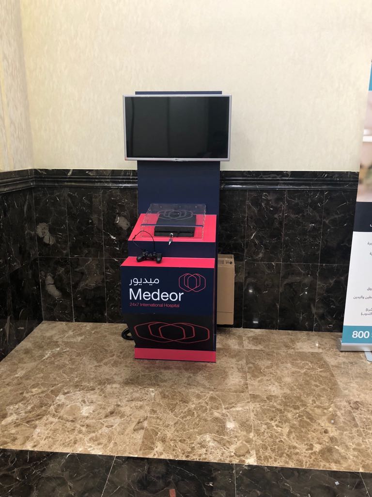 Medeor hospital gaming kiosk with PlayStation acrylic cover