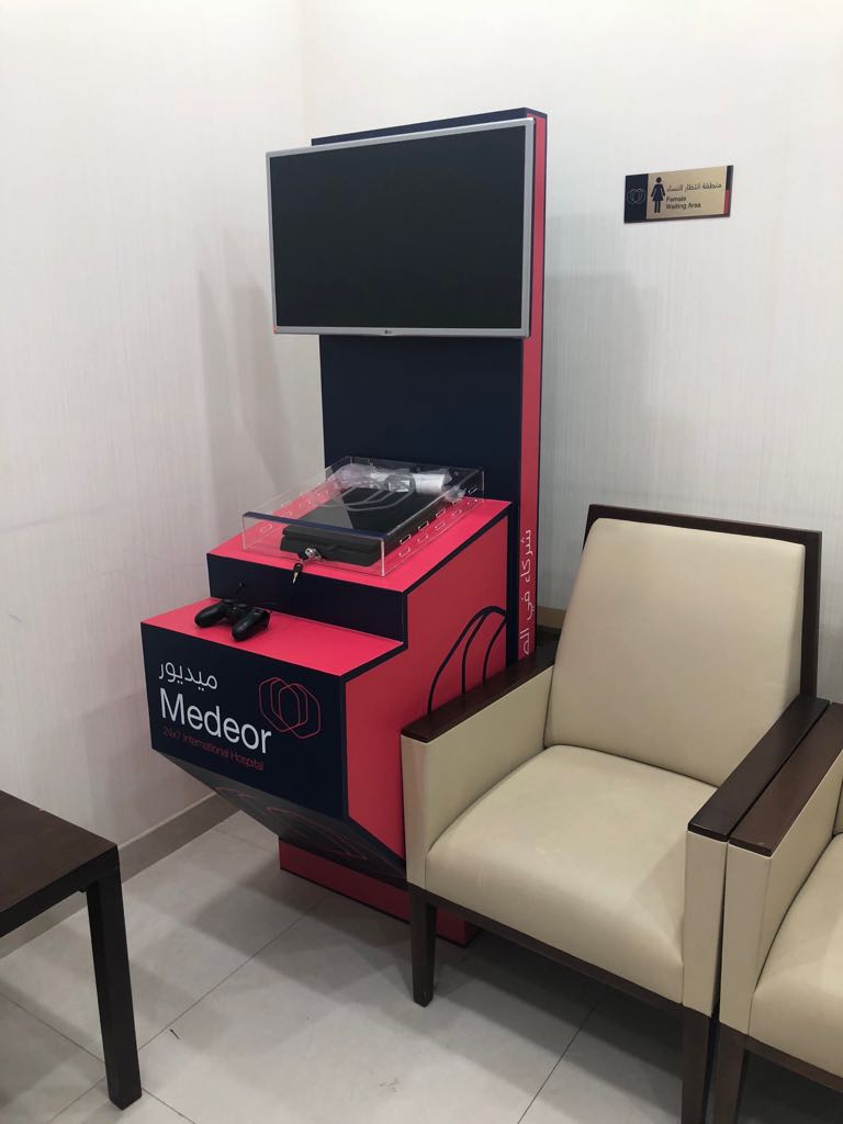 Medeor hospital gaming kiosk with acrylic console enclosure