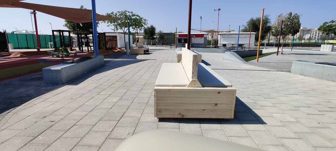 Outdoor seating planter fit-out in paved public area