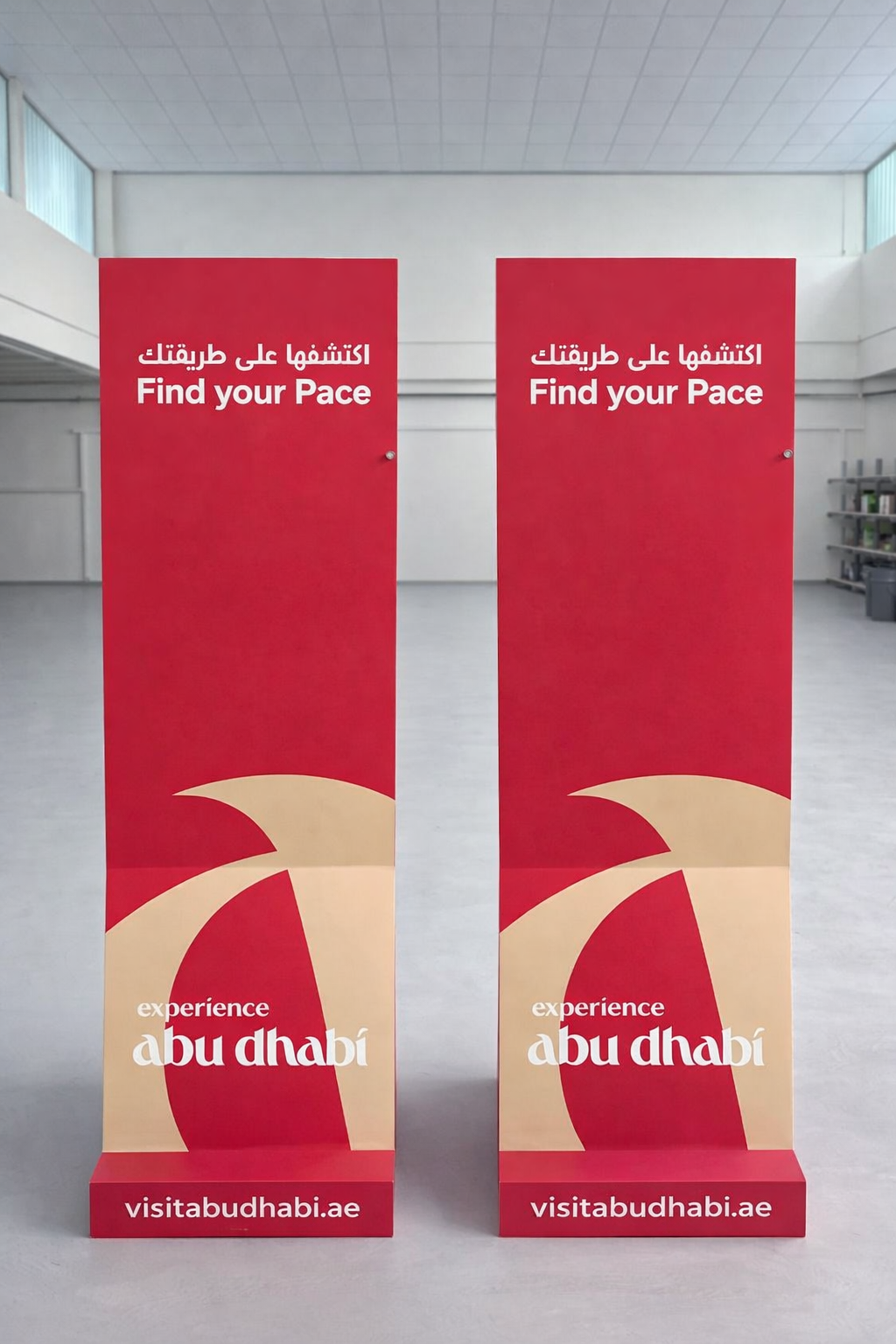 Red Abu Dhabi directional totems in a pair