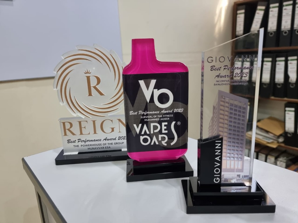 Collection of three custom acrylic performance awards